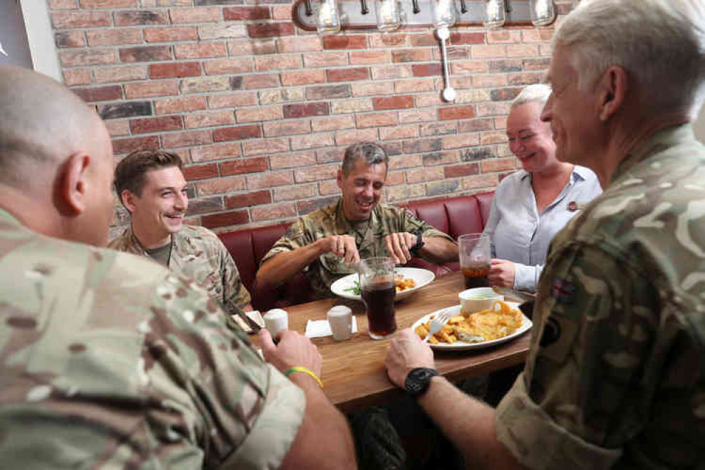 Military personnel enjoying a free breakfast. Image courtesy of Whitbread. Military personnel enjoying a free breakfast. Image courtesy of Whitbread.