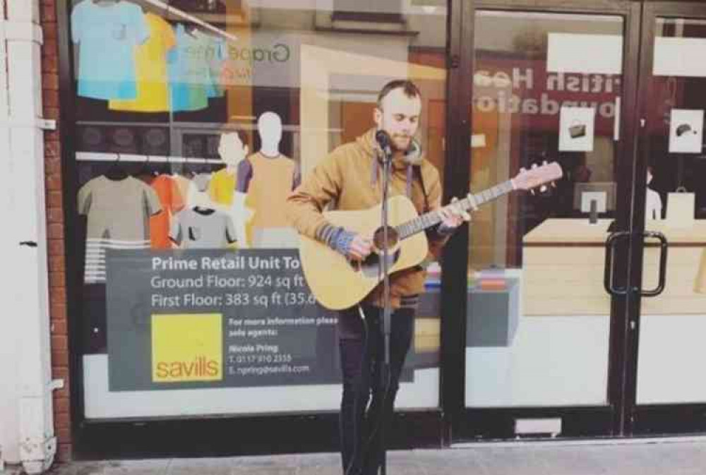 Bradley the Busker playing in Exmouth town centre.