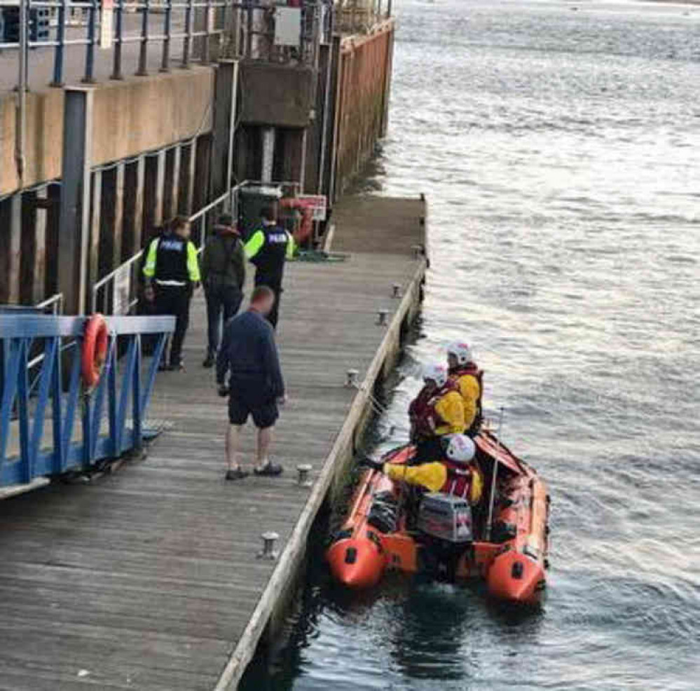 Police speak to those recovered from the vessel  Credit : Rob Vince/RNLI