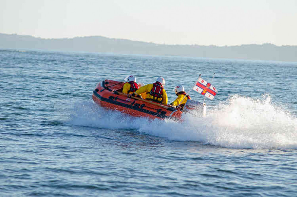 Exmouth RNLI Inshore Lifeboat Peggy D launches to the rescue.