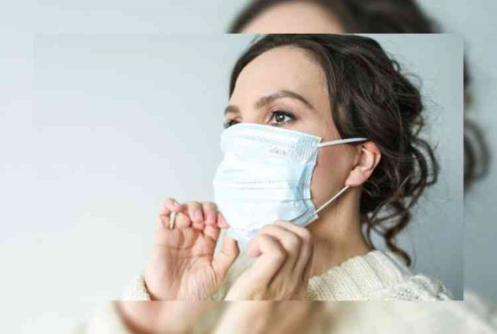 Stock image of a woman wearing a face mask. Image courtesy of Polina Tankilevitch from Pexels.