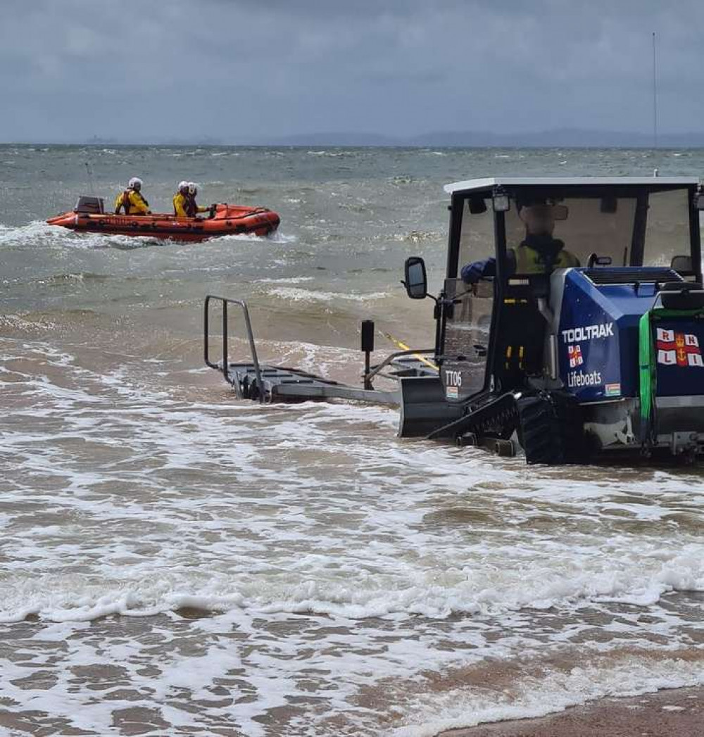 Exmouth RNLI Inshore Lifeboat launching. Credit: Mark Johnson Exmouth RNLI Inshore Lifeboat launching. Credit: Mark Johnson