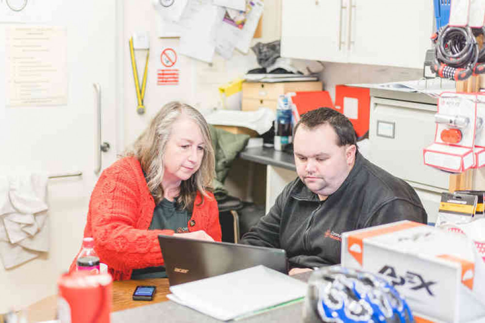 Annette Cormack helps a volunteer at Community Recycle Cycles