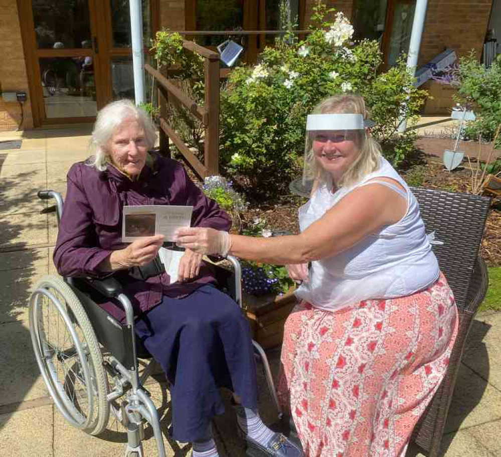 Belong Crewe resident Judith (left) with her daughter, Yvonne, holding granddaughter Ellie's card