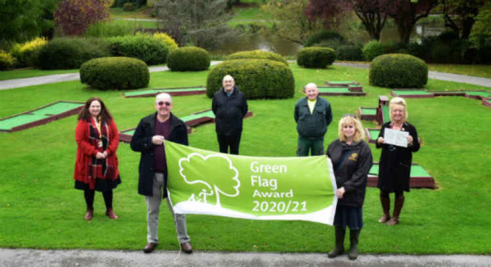 Green Flag raised in Queens Park by (l to r) Cllr Laura Crane, Derek Morgan, of Friends of the Park, Cllr Steve Hogben, ANSA's David Thomas, Sheila Blackburn, of Friends of the Park and Elaine Webster, ANSA parks chief