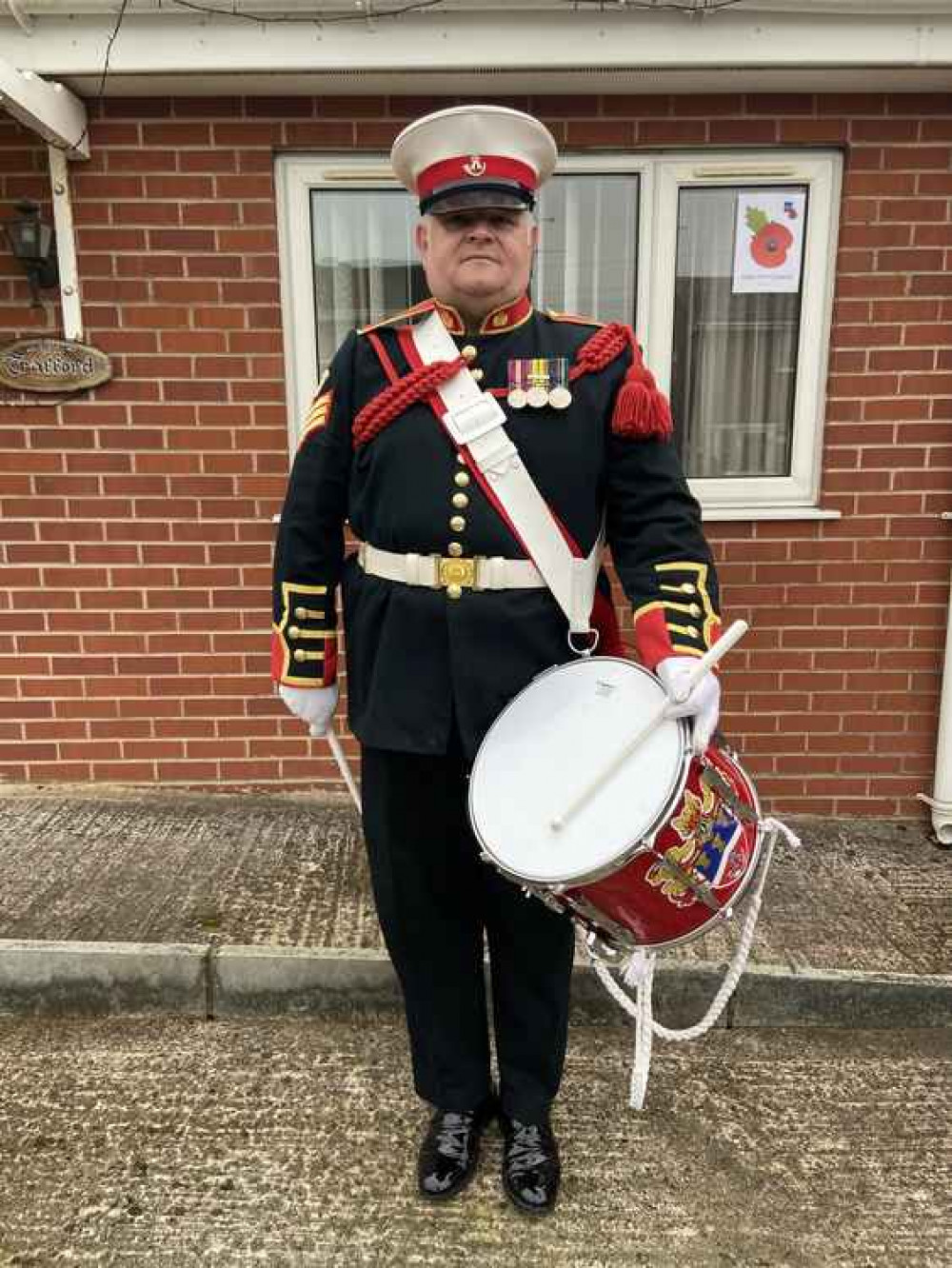 Rob Richardson prepares to drum on his driveway at Wistaston.