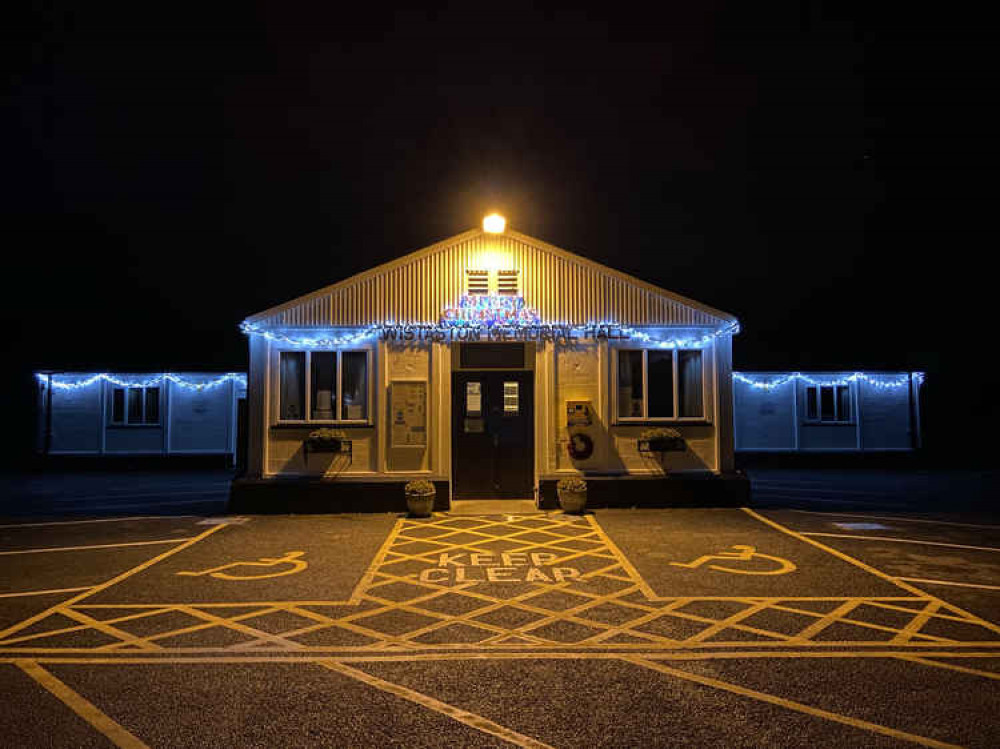 The lights are shining brightly now at the hall. The lights are shining brightly now at the hall.