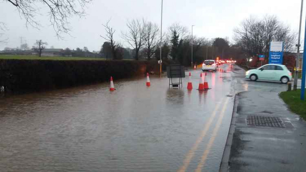 Smithy Lane was partly closed near to its entrance to Leighton Hospital.