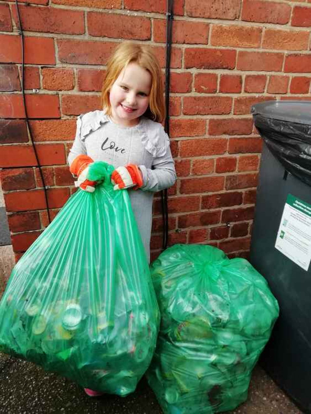 Georgie with cans separated during a litter pick.