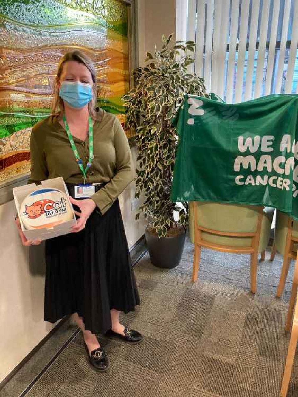 Cat Cake is presented to the Macmillan nurses at Leighton Hospital