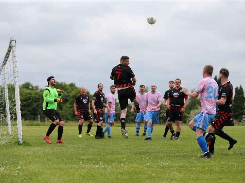 Heart Warriors FC head the ball clear of the danger zone (Image: Jonathan White)