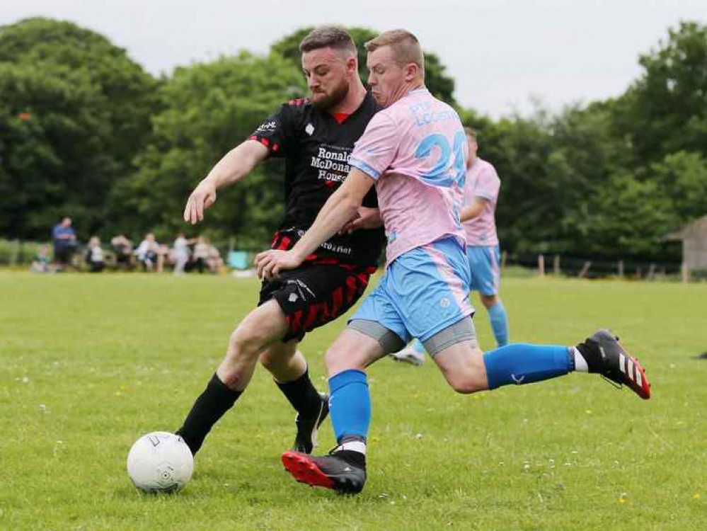 Calm 84 FC Crewe and Heart Warriors FC players fight for the ball (Image: Jonathan White)