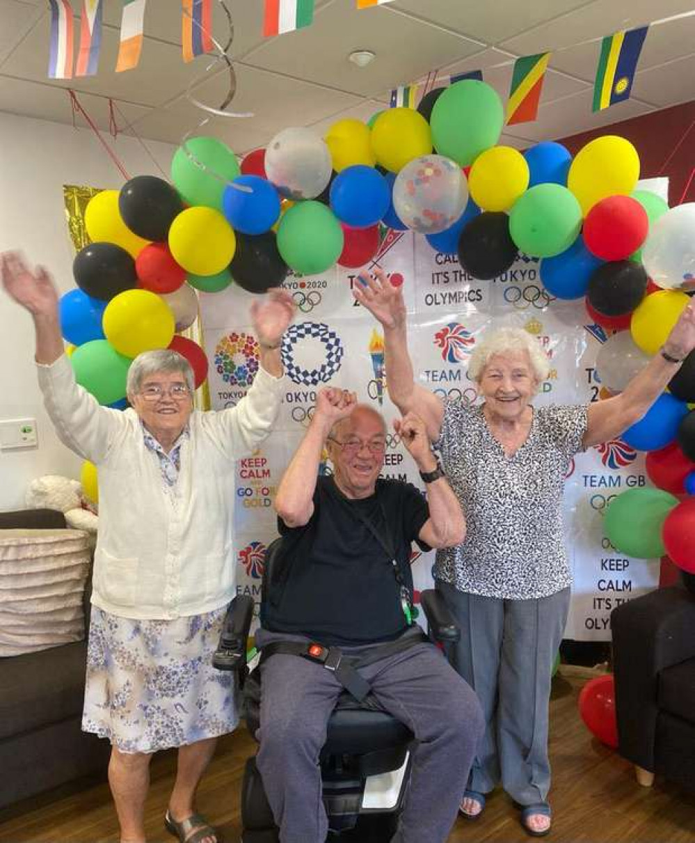 Belong residents (l to r) Mary Britcliffe, Ken Edwards and Margaret Jackson enjoy their own Olympics.