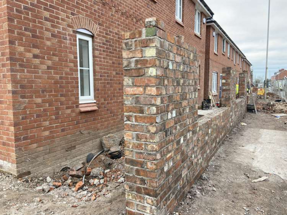 Developers have built a small 'replacement' wall in front of the new housing on West Street (Picture: Jonathan White).