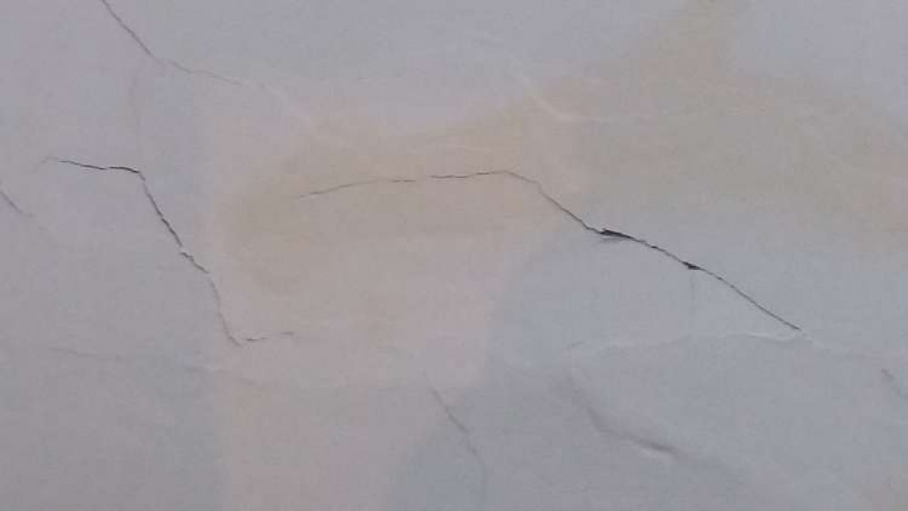 The cracks are on ceilings as well as walls, leaving decorating impossible.