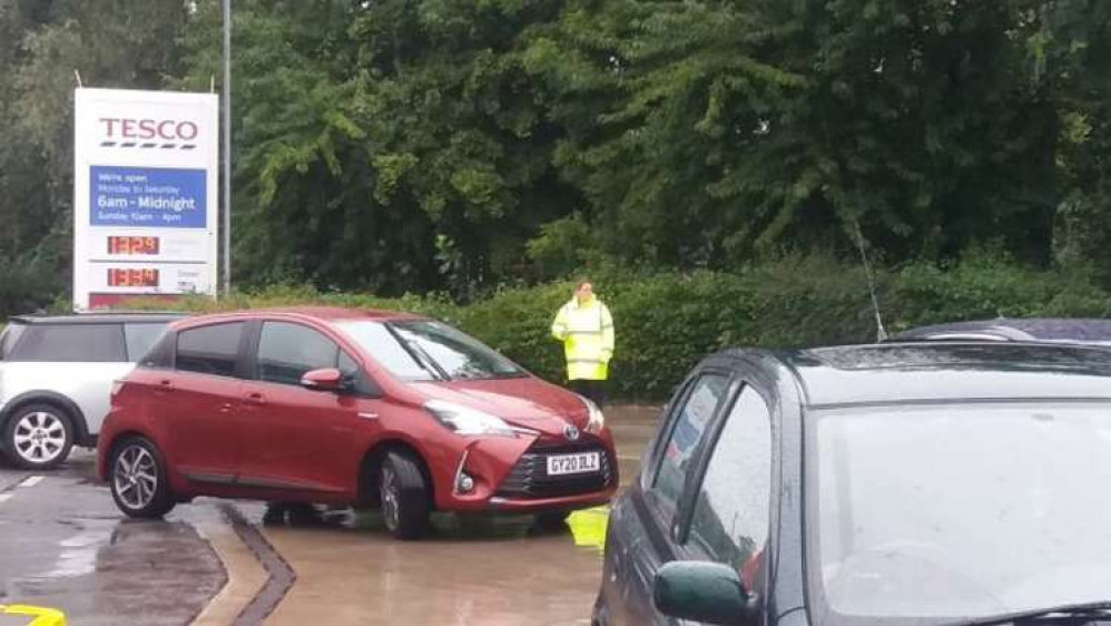 Staff ensure queues don't tail back across the main road at Tesco Extra.