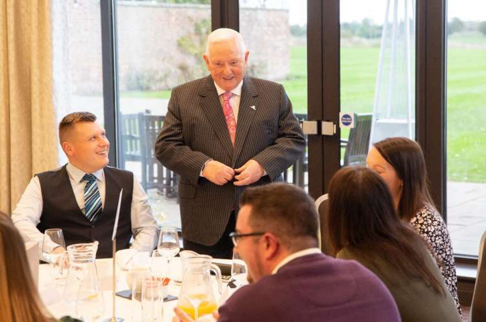 Swansway Group Chairman Michael Smyth with staff at the recent long-service lunch.