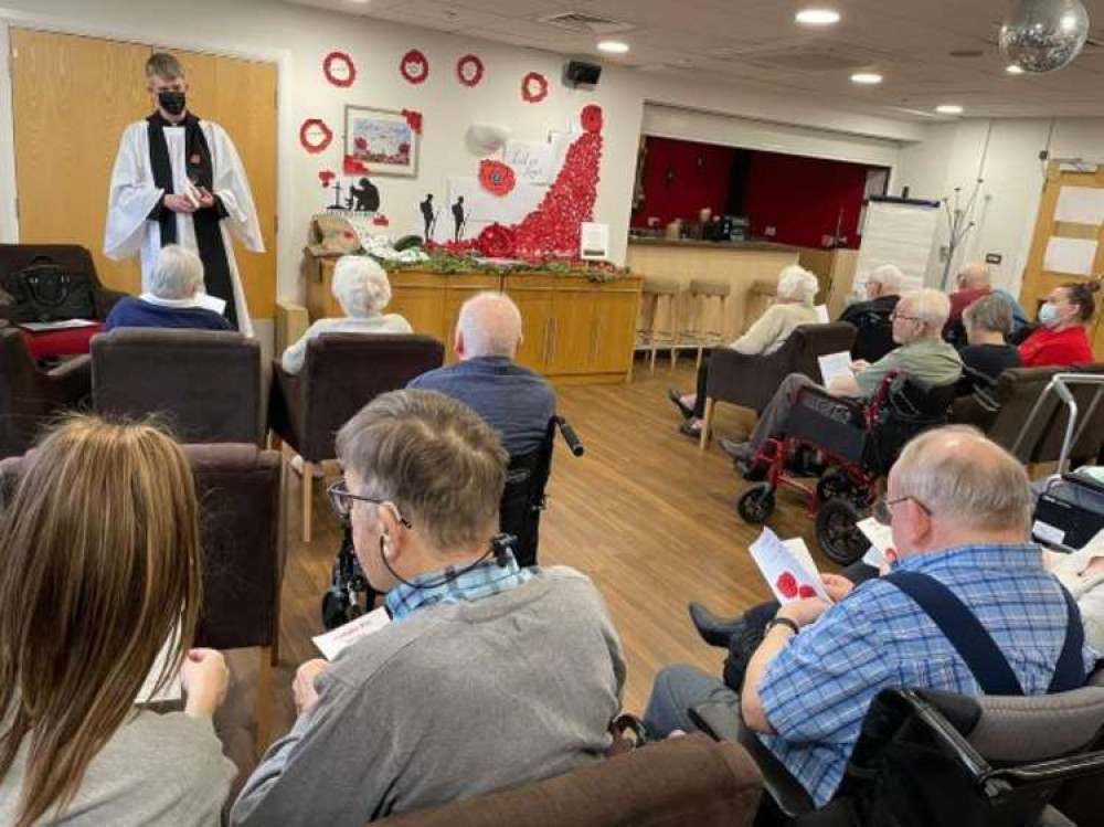 Rev. Peter Bennett leads the Armistice Day service at Belong Crewe.