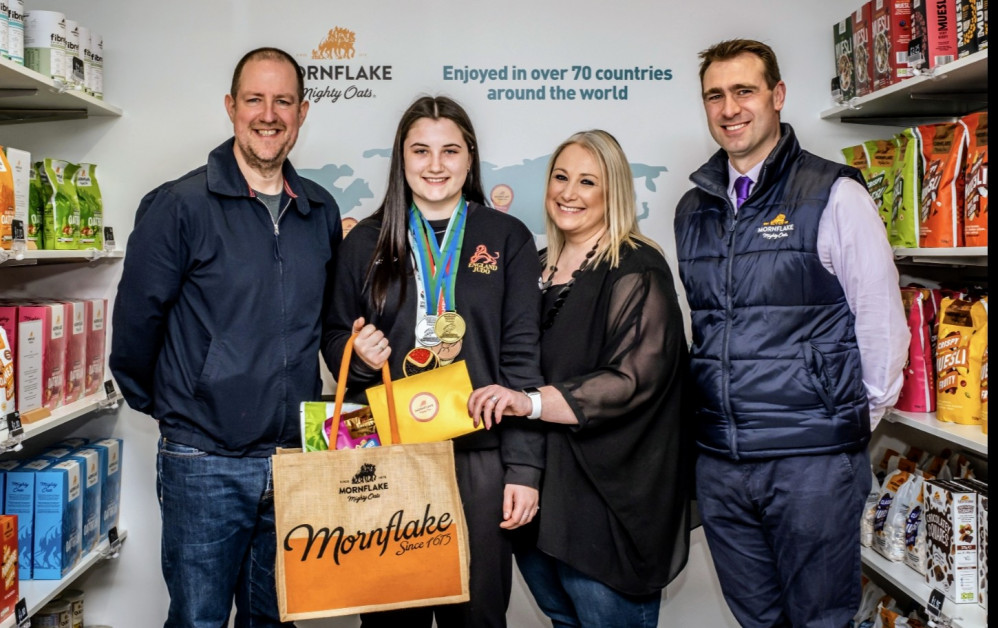 Milly and parents meeting Mornflake managing director James Lea in the firm’s shop on Gresty Road (Jan Roberts).