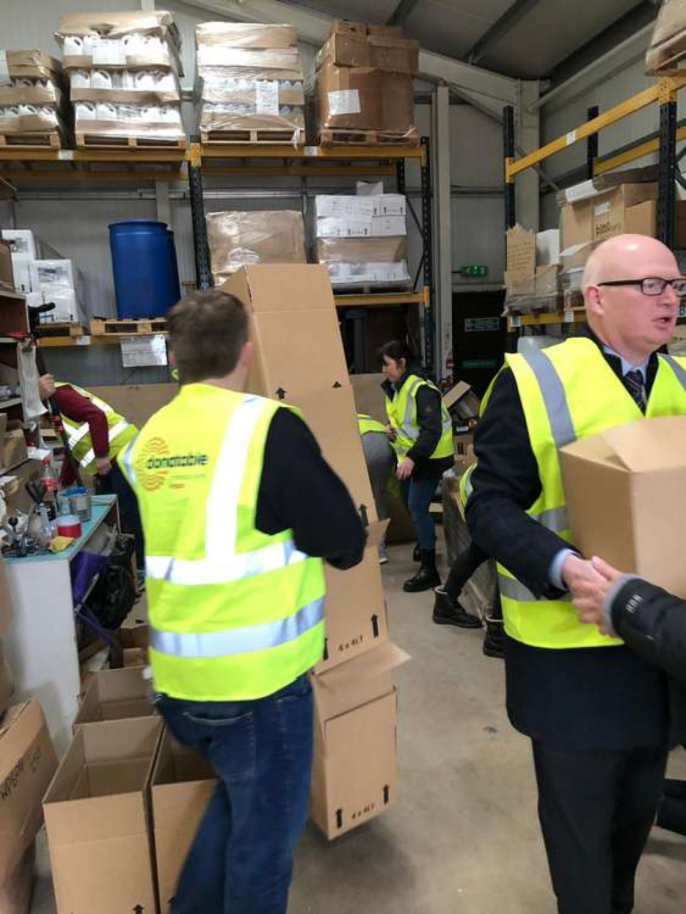 Volunteers sorting out the donation boxes.