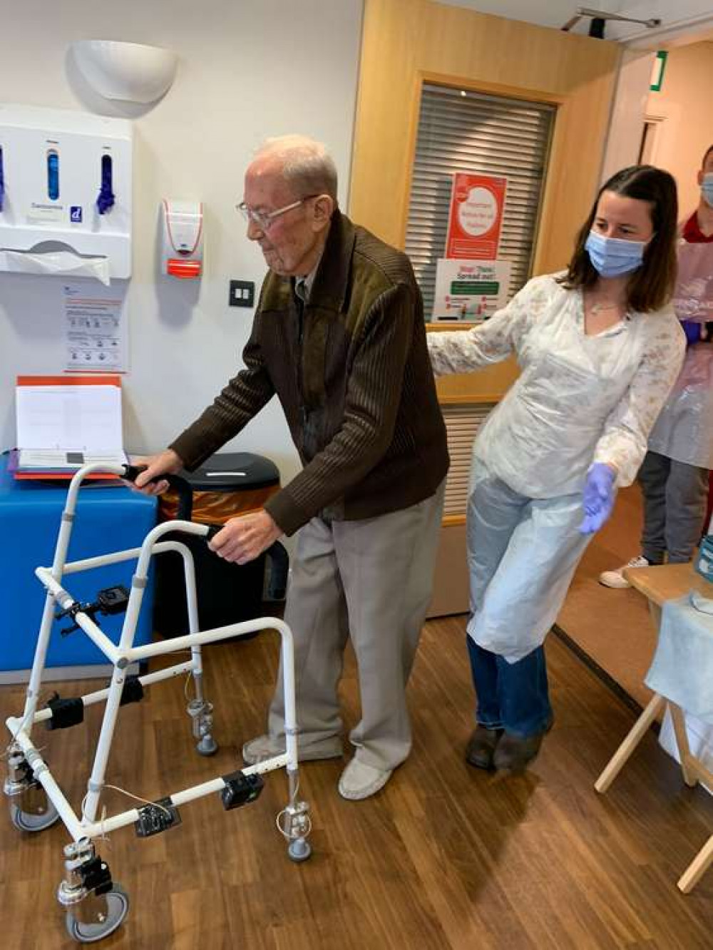 Roy Broadfield (95) with a walking aid. Belong Crewe