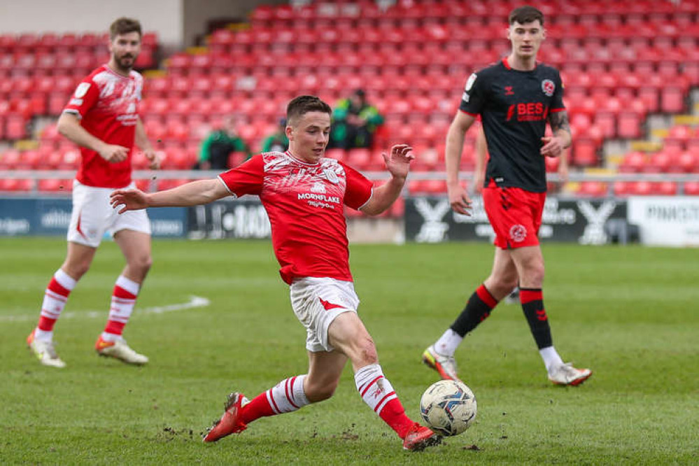 Tommy Lowery in the thick of it; the midfielder was the sponsors' man of the match (Picture credit: Kevin Warburton).