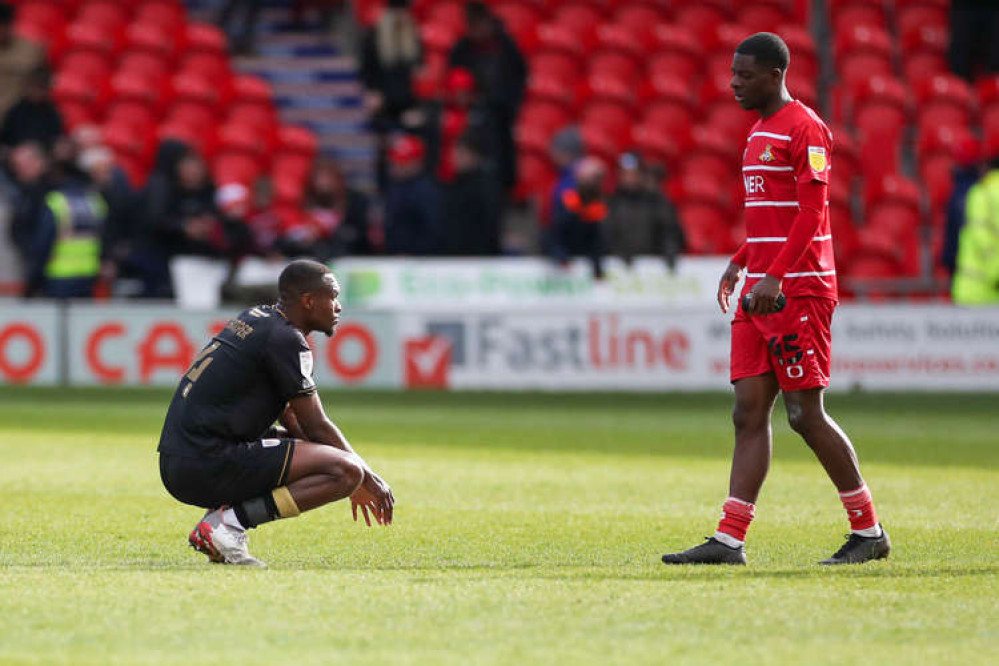 Rekeem Harper sinks to his knees at the final whistle at the Eco-Power Stadium (Picture credit: Kevin Warburton).