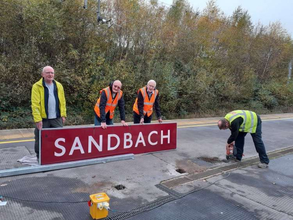 DSL and Friends of Sandbach Station installing the sign today