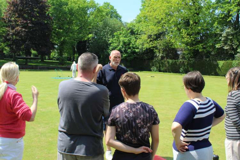 Peter Dickens coaches the latest crop of new players. Photo courtesy of Titchfield Park Bowls Club.