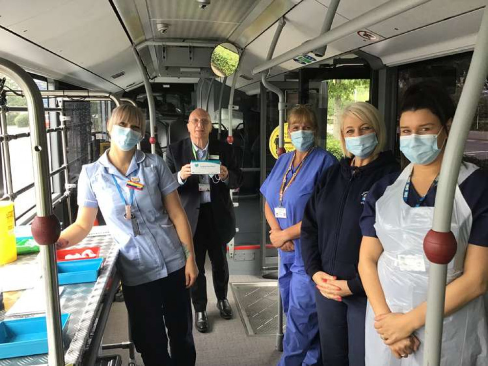 The photo shows Councillor John Wilmott with the bus staff on the vaccination bus the last time it visited Hucknall. Photo courtesy of Ashfield District Council.