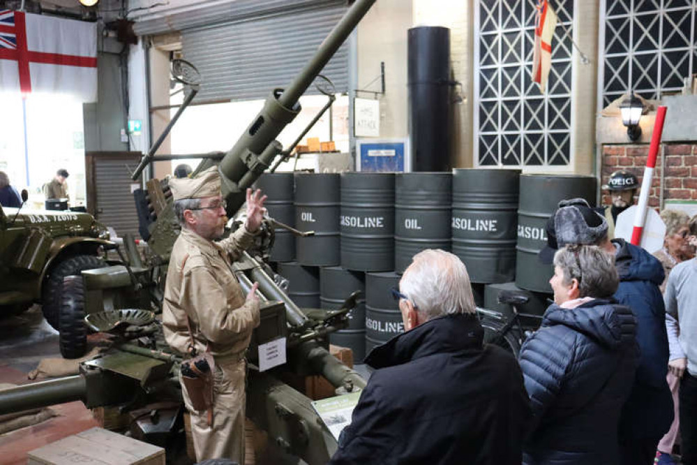 D-Day volunteer Mark Hanson tells visitors about the centre's Bofors Gun, which also appeared on 'Band of Brothers'