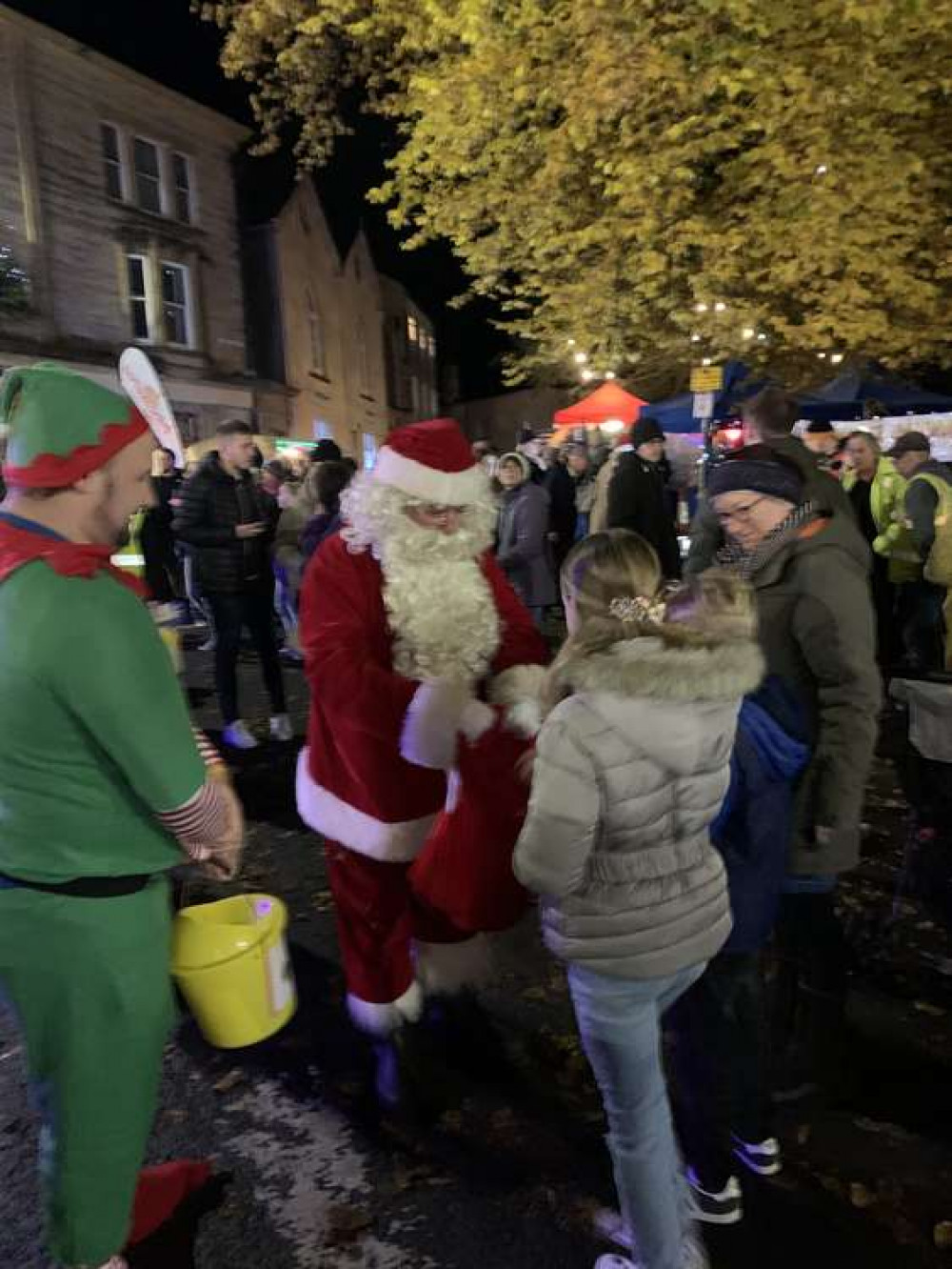 Father Christmas paid an early visit, accompanied by one of his elves, handing out sweets to the children Father Christmas paid an early visit, accompanied by one of his elves, handing out sweets to the children