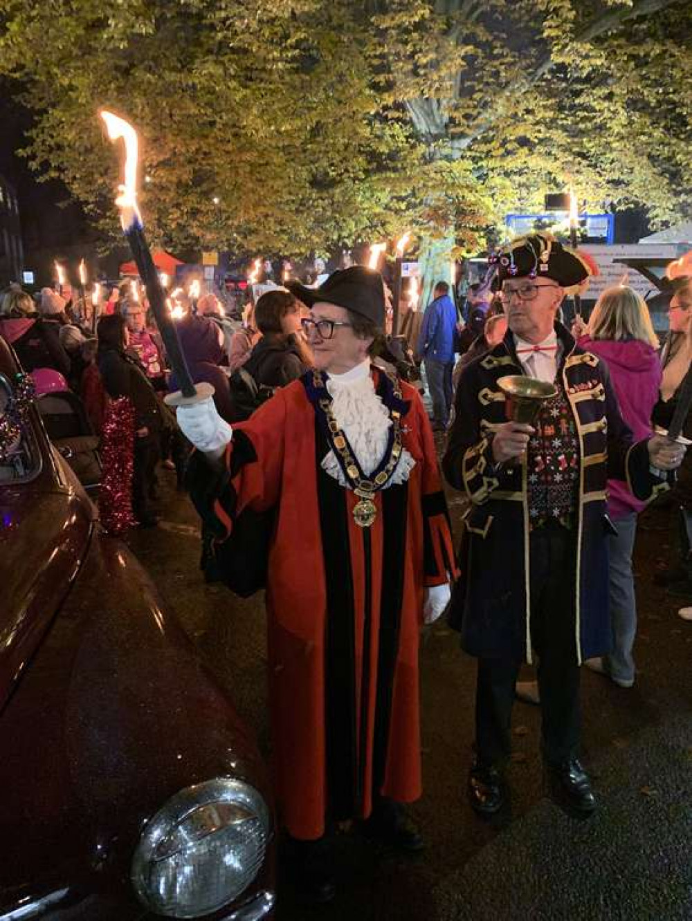 The Mayor, Cllr Jill Farrow, accompanied by town crier Nick Goodwin, leads the torchlight procession The Mayor, Cllr Jill Farrow, accompanied by town crier Nick Goodwin, leads the torchlight procession