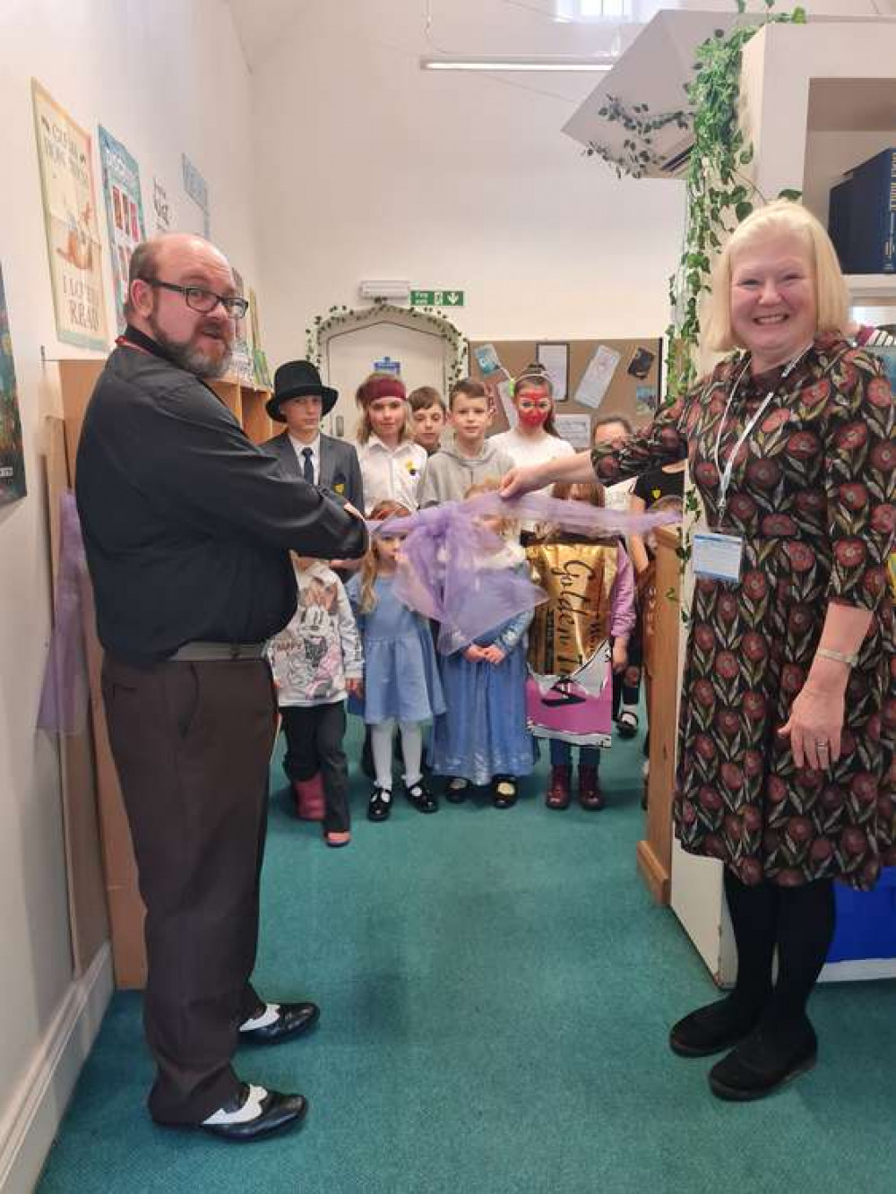 Children's author Leigh Conley and chair of the school governors, Andrea Sedgewick, open the new library