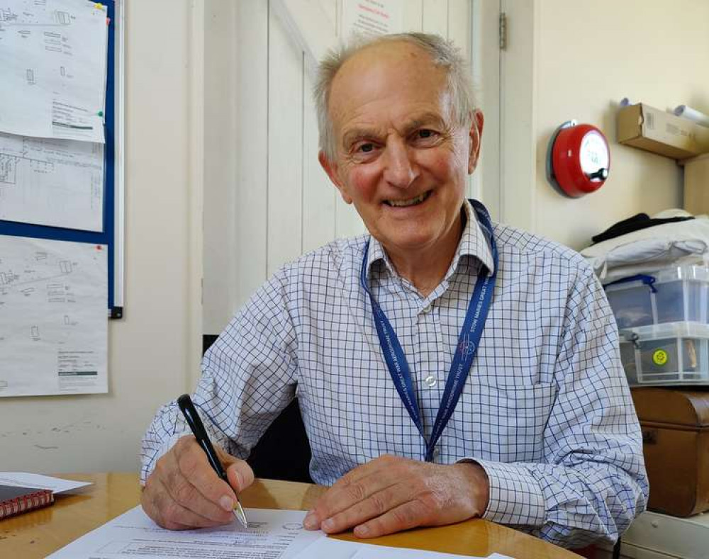 Barry Dickens, chairman of Stow Maries, signing the accreditation documents from Arts Council England (Photo: Stow Maries Great War Aerodrome)