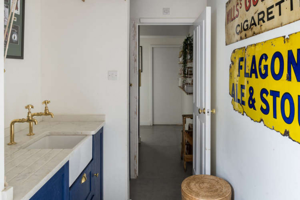 A utility room is hidden behind the kitchen (Image: The Modern House)