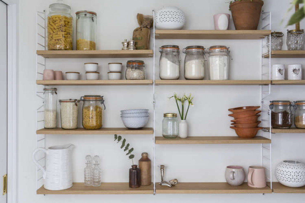 Concealed behind navy-blue doors is the pantry (Image: The Modern House)