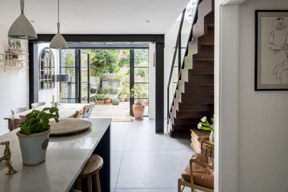 The full-height doors to the garden foster a wonderful sense of floor between indoor and outdoor spaces (Image: The Modern House)