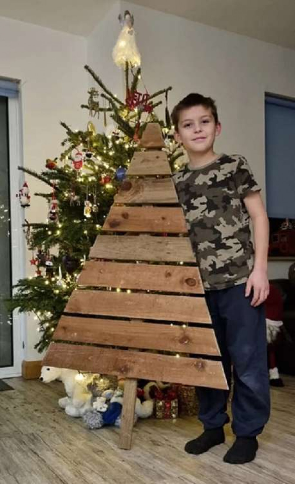 Noah Last with one of his had made Christmas trees (Picture credit: Michelle Last)