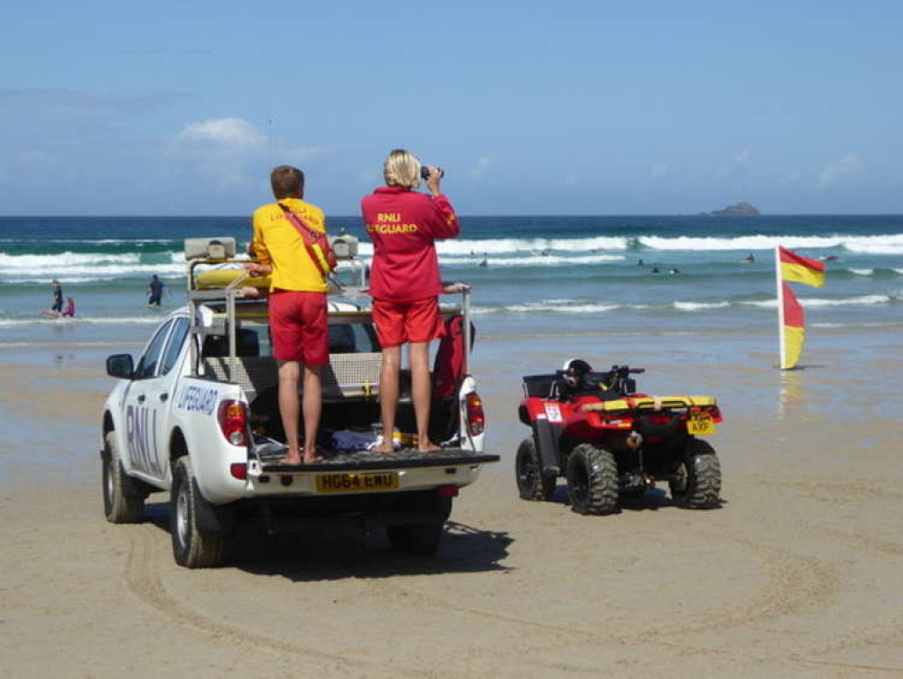 RNLI lifeguards on duty on Sennen beach cc-by-sa/2.0 - © Rod Allday - geograph.org.uk/p/4641879