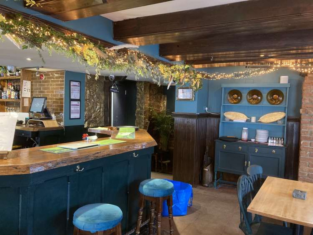 Bar stools with green covers, hanging foliage, fairy lights (Nub News, Will Goddard)