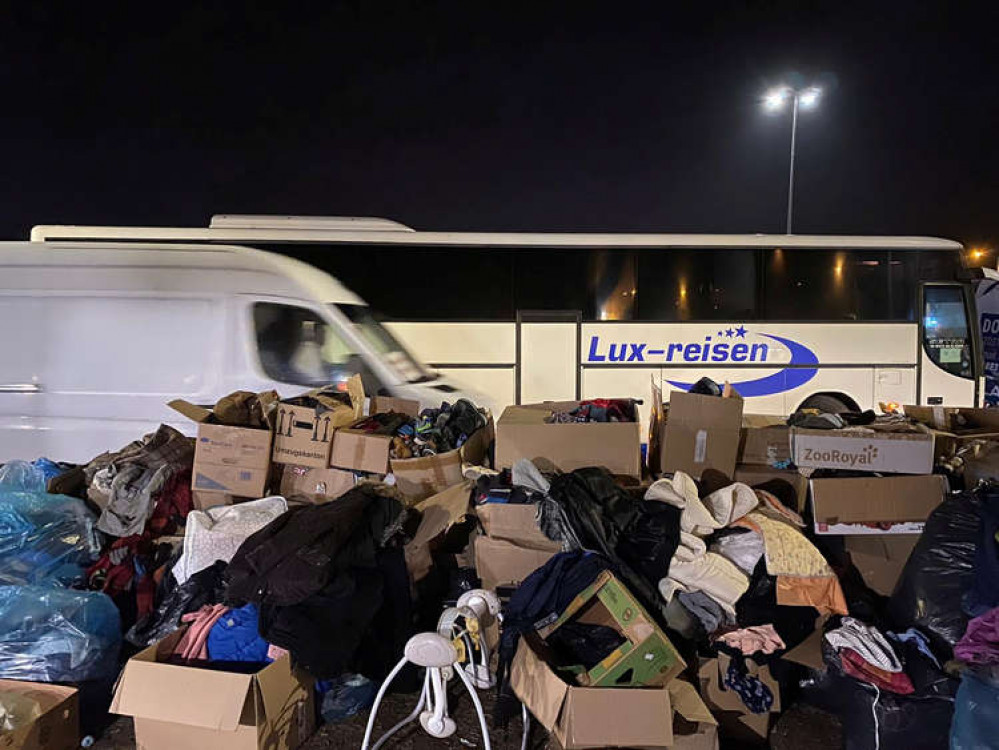 These photos show huge mounds of clothing donated by well-meaning Europeans dumped and abandoned in a car park on the Polish-Ukrainian border.