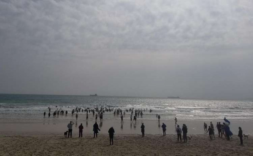 Photo of the swimmers braving the cold water at Gylly Beach. Photo shared by Chilly Chilli Dip/Facebook. Photo of the swimmers braving the cold water at Gylly Beach. Photo shared by Chilly Chilli Dip/Facebook.