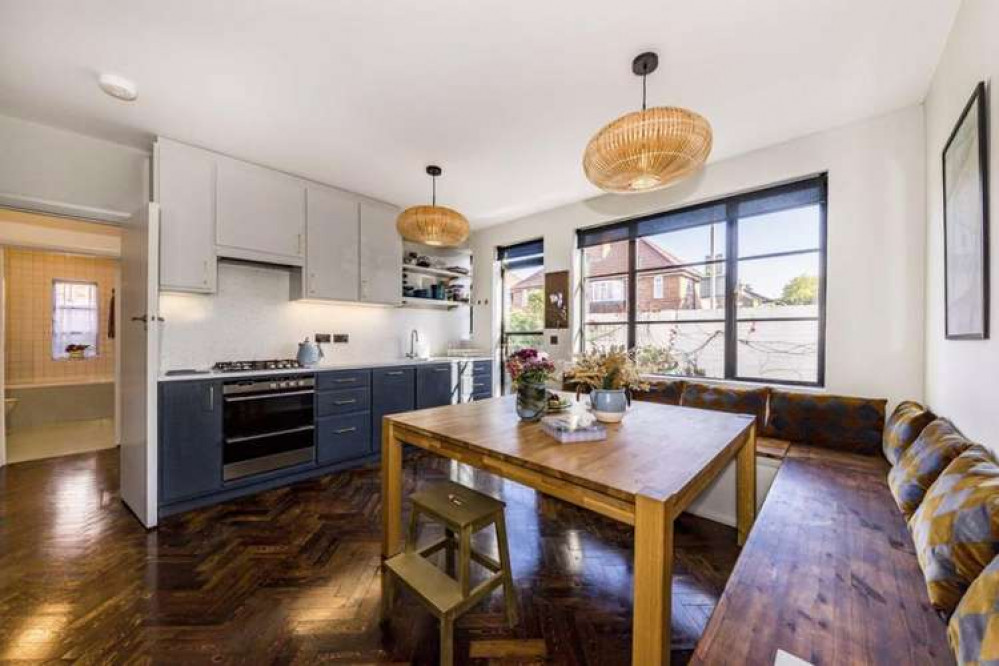 The modern kitchen with side-door leading onto the garden (Image: Dexters)