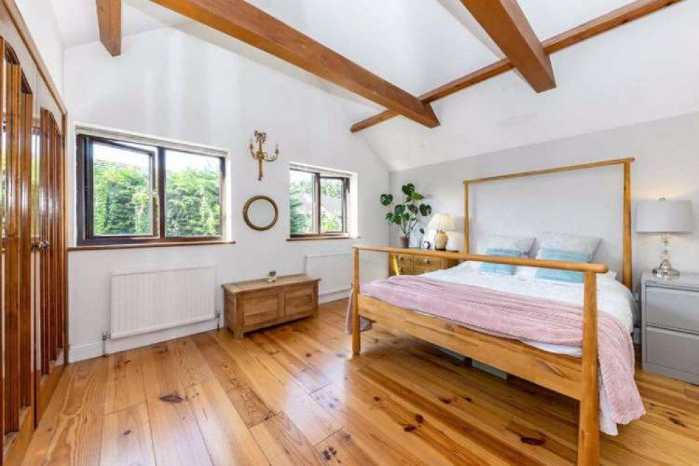 Exposed wooden beams in one of the bedrooms (Image: Dexters)