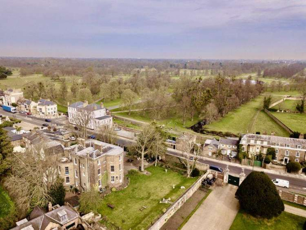 An aerial view of the house on the market with Strutt and Parker