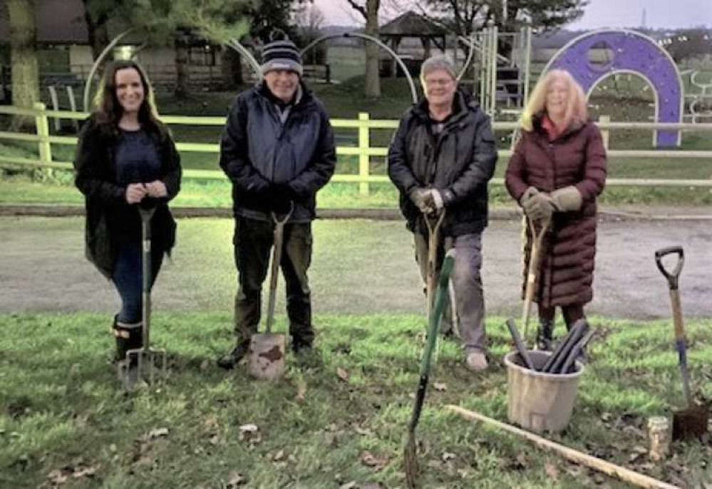 Rotary Club members planting trees throughout the community Rotary Club members planting trees throughout the community