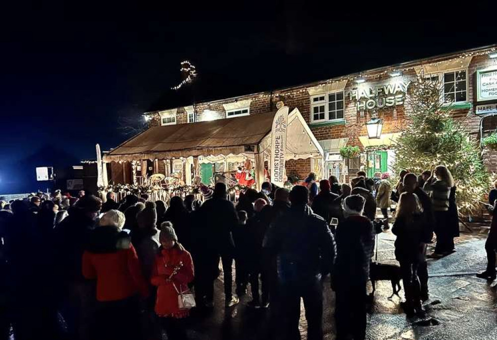 A Christmas scene at The Halfway House in Donisthorpe as residents sing festive songs. Photo: Peter Gale