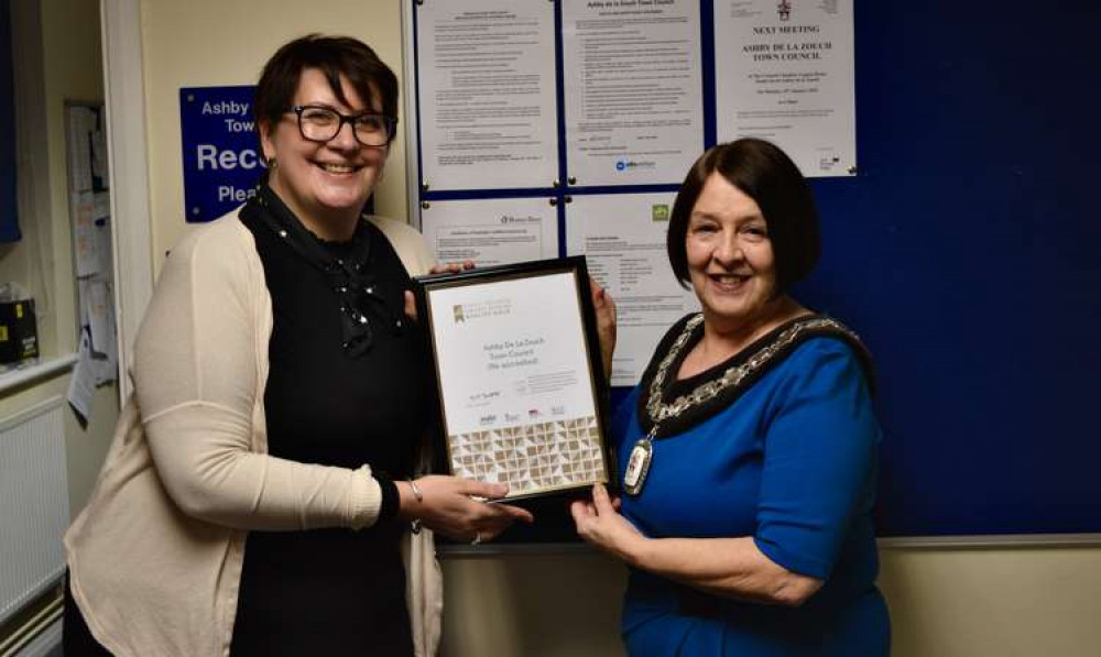 Ashby Mayor Cllr Rita Manning accepts the award from Kristy Ball, the Team Leader of the Communities Team at Leicestershire County Council