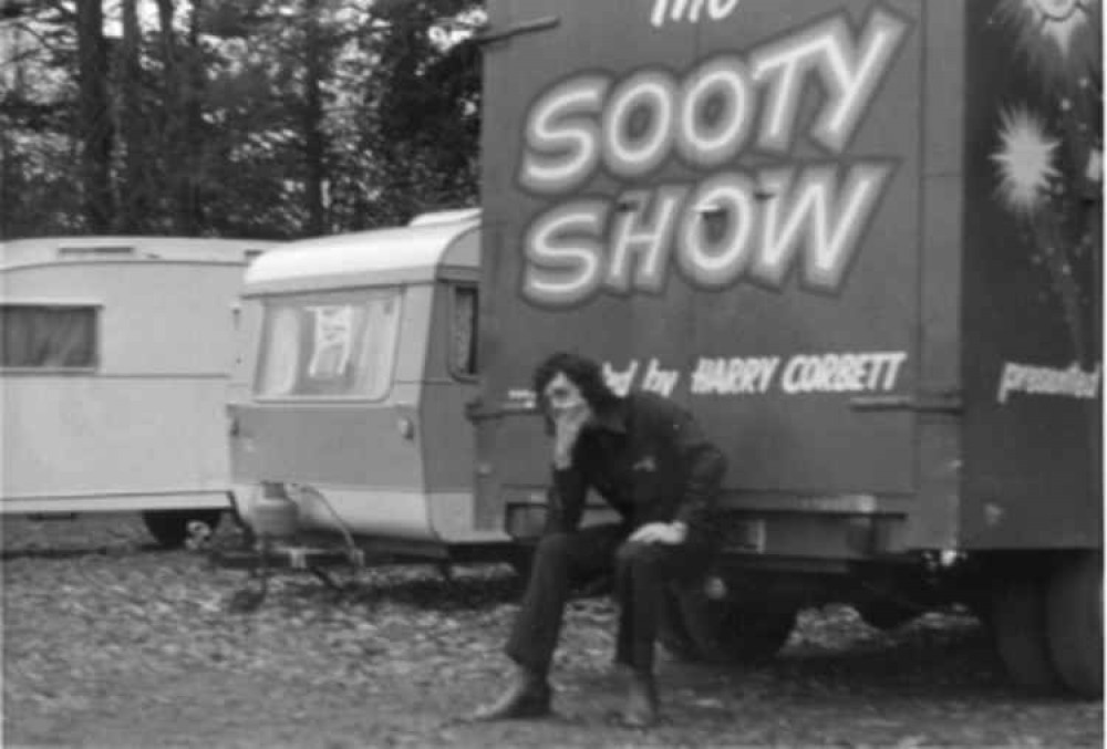 Robin Vyrnwy-Pierce sitting on the Sooty Show towing bar in the 1970s